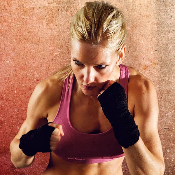 Mixed Martial Arts Lessons for Adults in Katy TX - Lady Kickboxing Focused Background